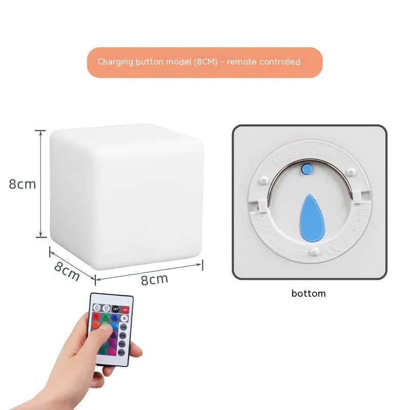 Small square night light showing seven colour changing modes, with remote control.