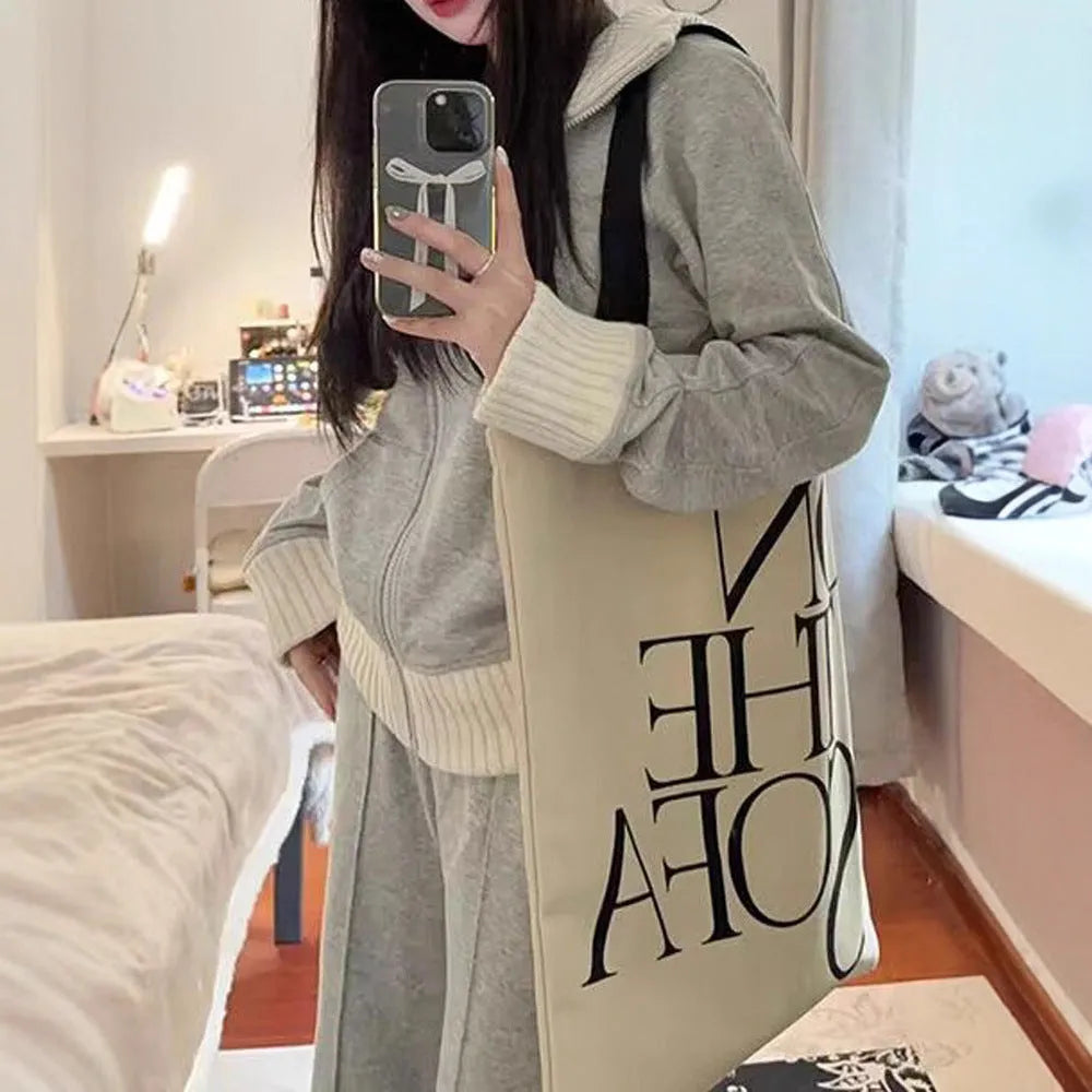 Light gray women's casual two-piece set with coat having pockets and wide leg trousers