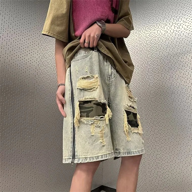 Man wearing yellow mud camouflage print cotton denim shorts with a straight-leg, fifth-length Korean style cut.