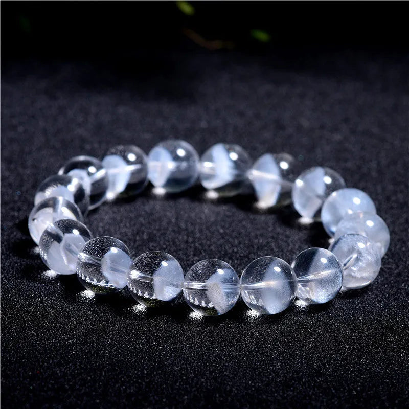 Women's white crystal pyramid bracelet with Ruyi design elements showing pyramid shapes and adjustable sizing