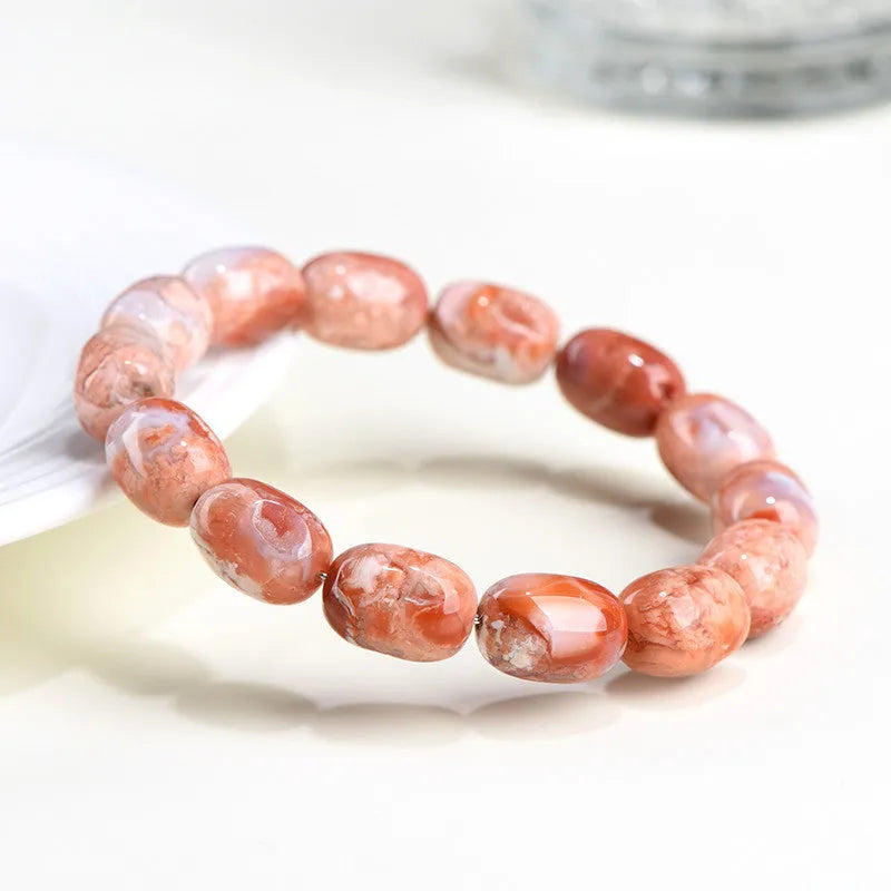 Natural cherry agate bracelet with 10x14mm barrel beads and traditional Ruyi design elements