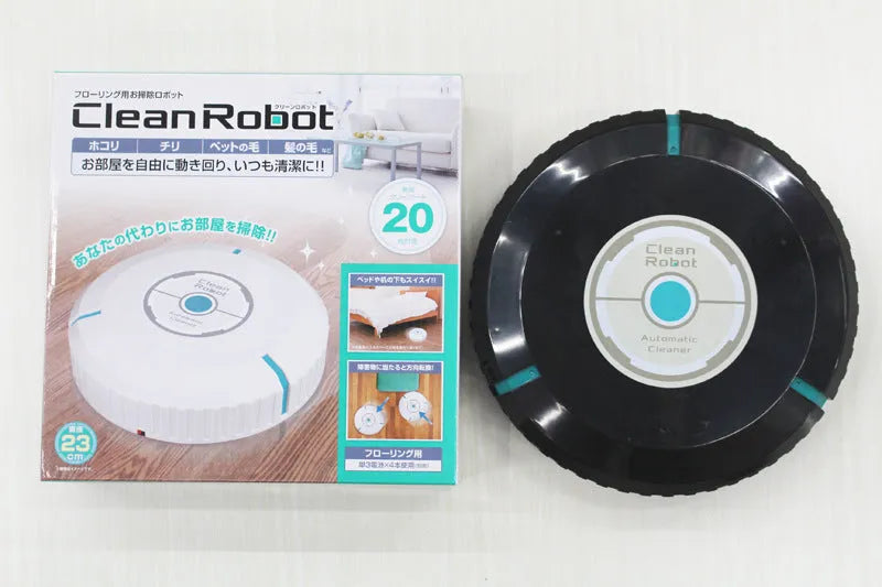 Black and white ABS plastic robot floor sweeper automatic cleaner on wooden floor