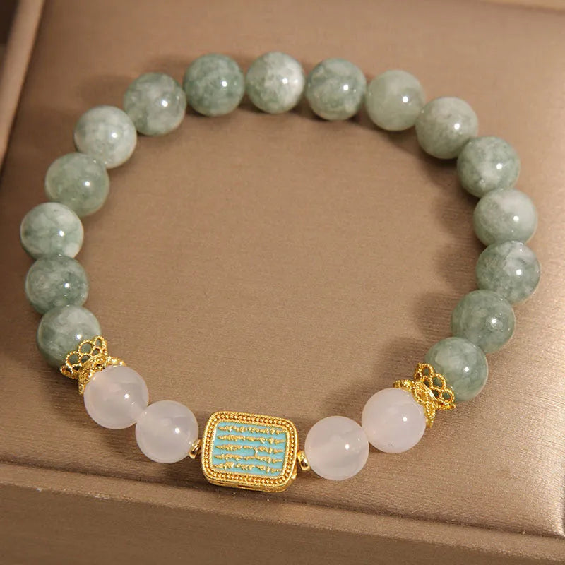 Women's oil green emerald crystal bracelet with five scriptures design on white background