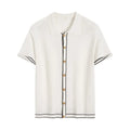 Women's white short sleeve cardigan shirt with contrast colour lapels on a hanger.