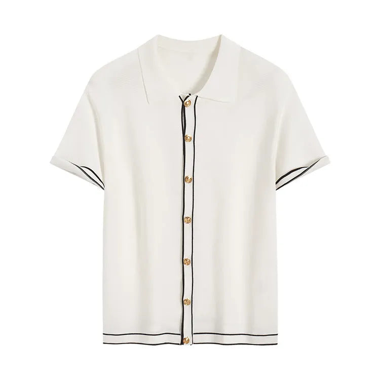 Women's white short sleeve cardigan shirt with contrast colour lapels on a hanger.