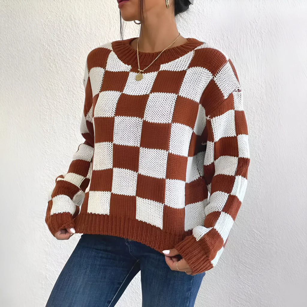 Dark brown plaid pattern loose fit pullover sweater with long sleeves and a round neck.
