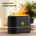 Black and white USB humidifier showing seven-colour flame light effect on a desk.