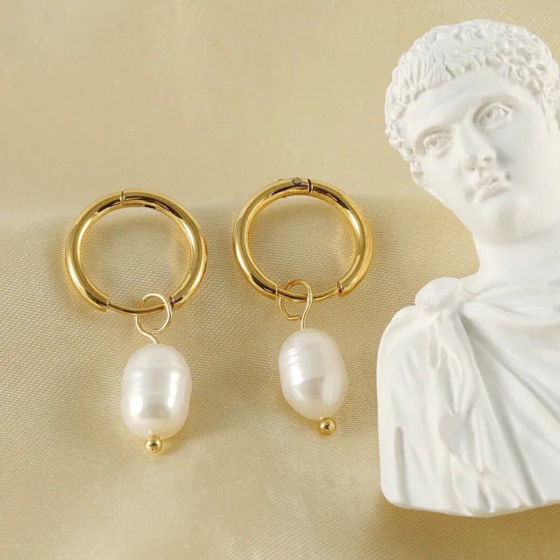 Gold coloured stainless steel geometry earrings with pearl decorative elements for women