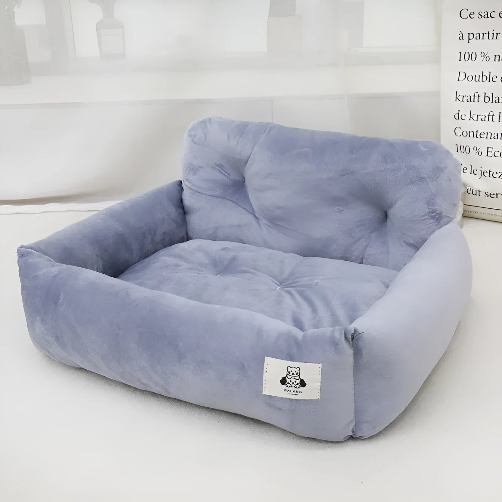 Car-mounted pet travel nest in stain-resistant cloth, showing grey and blue plaid options with size dimensions