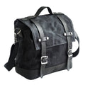 Waterproof canvas motorcycle side pannier bag in black mounted to motorcycle