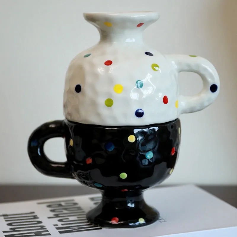Hand-pinched irregular shaped ceramic mug in solid colour with modern simplicity design