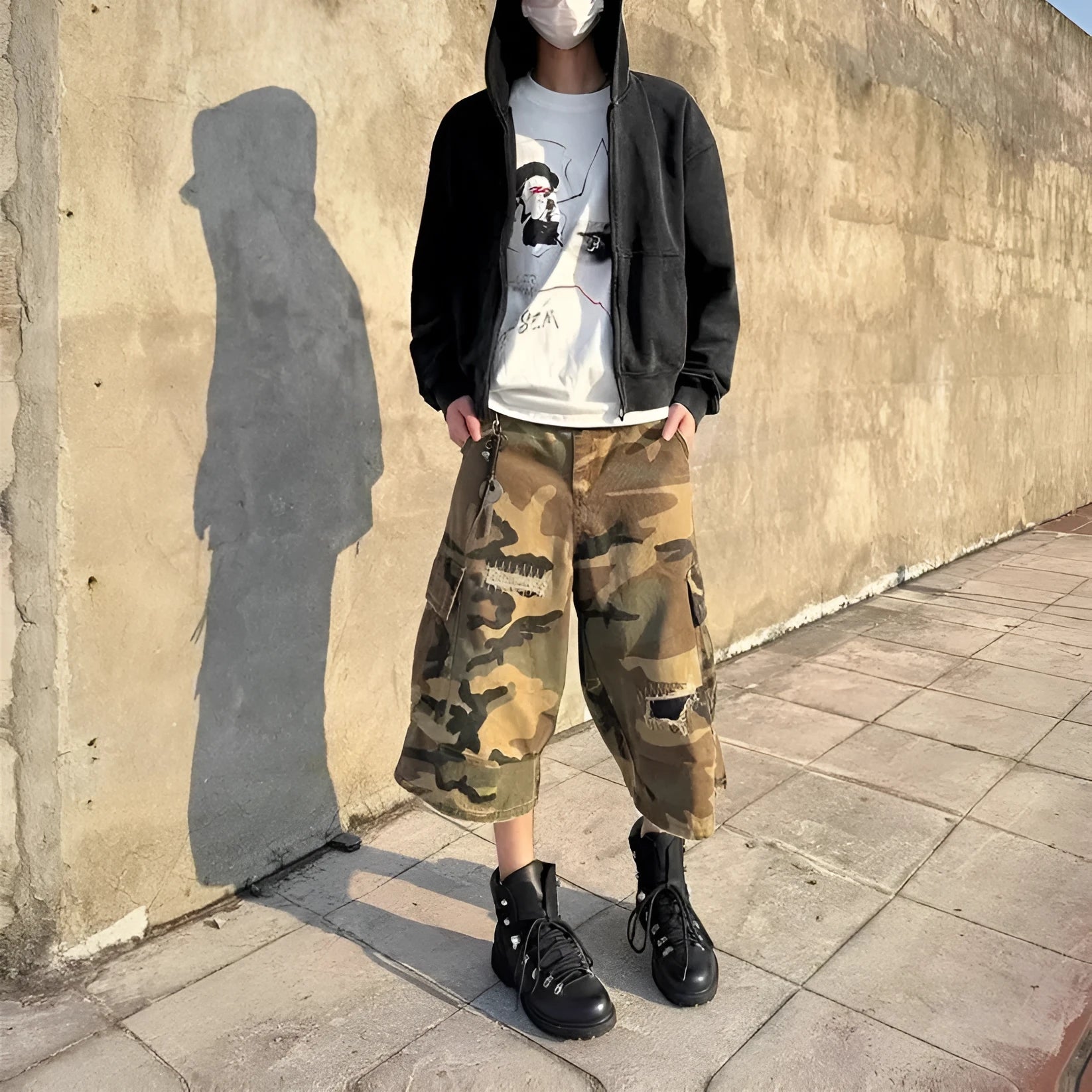 Men's camouflage cropped jeans with patch detailing and ripped accents in straight leg style