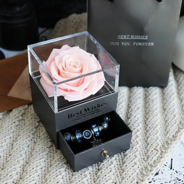 Eternal Flower gift box with preserved roses and carnations inside, measuring 8.5 cm square by 10.5 cm high