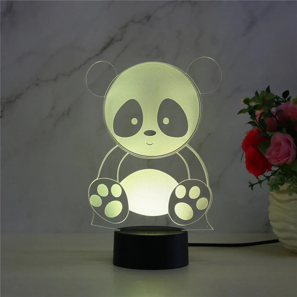 Panda-shaped acrylic night light with remote control displaying multiple colours on a black ABS base.
