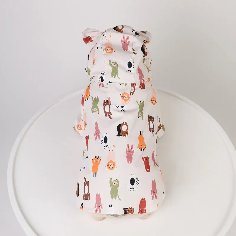 Beige dog raincoat with cartoon design featuring double waterproof PU coating