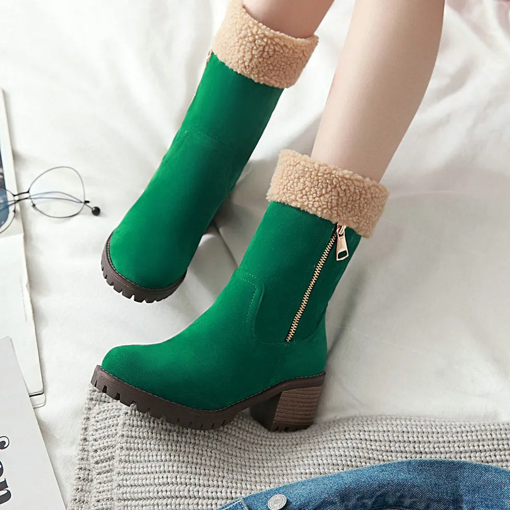 A pair of snow boots with a rubber sole and plush lining on a winter background.