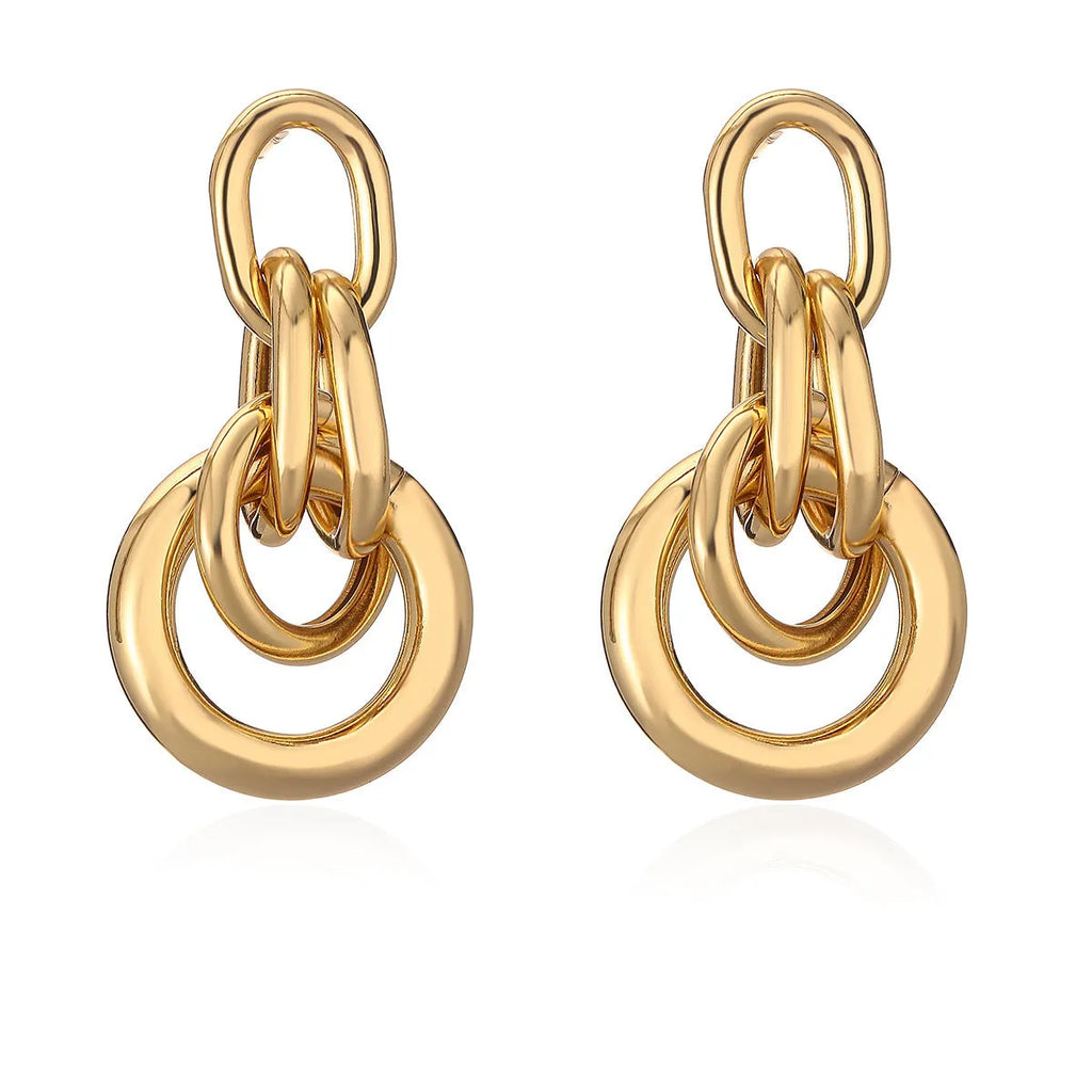 Women's gold geometric earrings with irregular shapes and high-profile metallic style