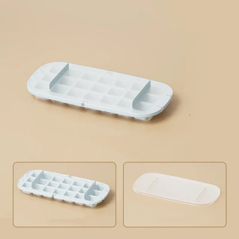 Yellow high-capacity ice cube tray with grid design and a storage slot for an ice shovel.