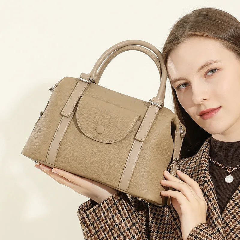 Genuine leather ladies handbag with contrast stitching and metal lock detail