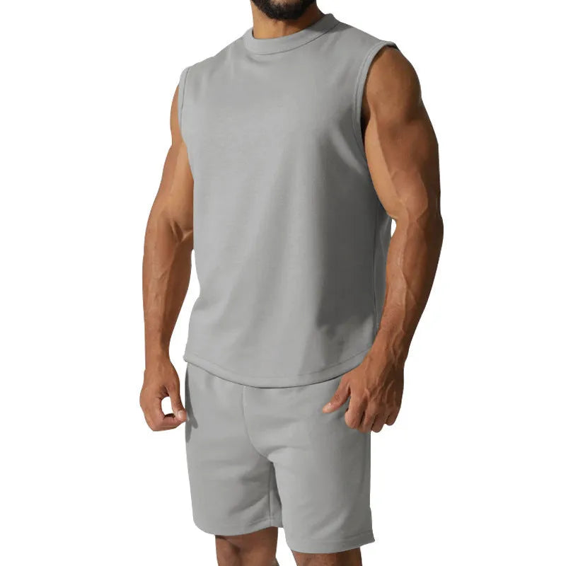 Men's solid colour sleeveless sports top and matching casual shorts set on a hanger
