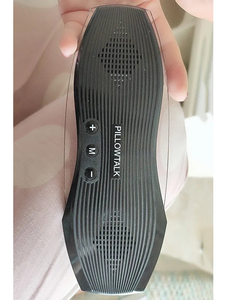 Black true wireless earbuds and their USB charging case, designed for sleep.