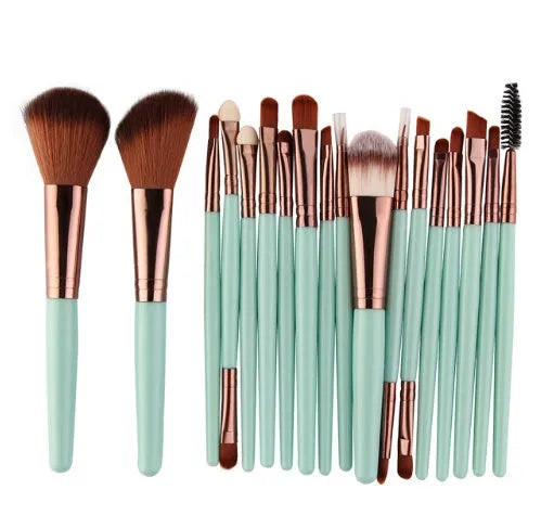 18-piece makeup brush set with fan brushes arranged on a table.