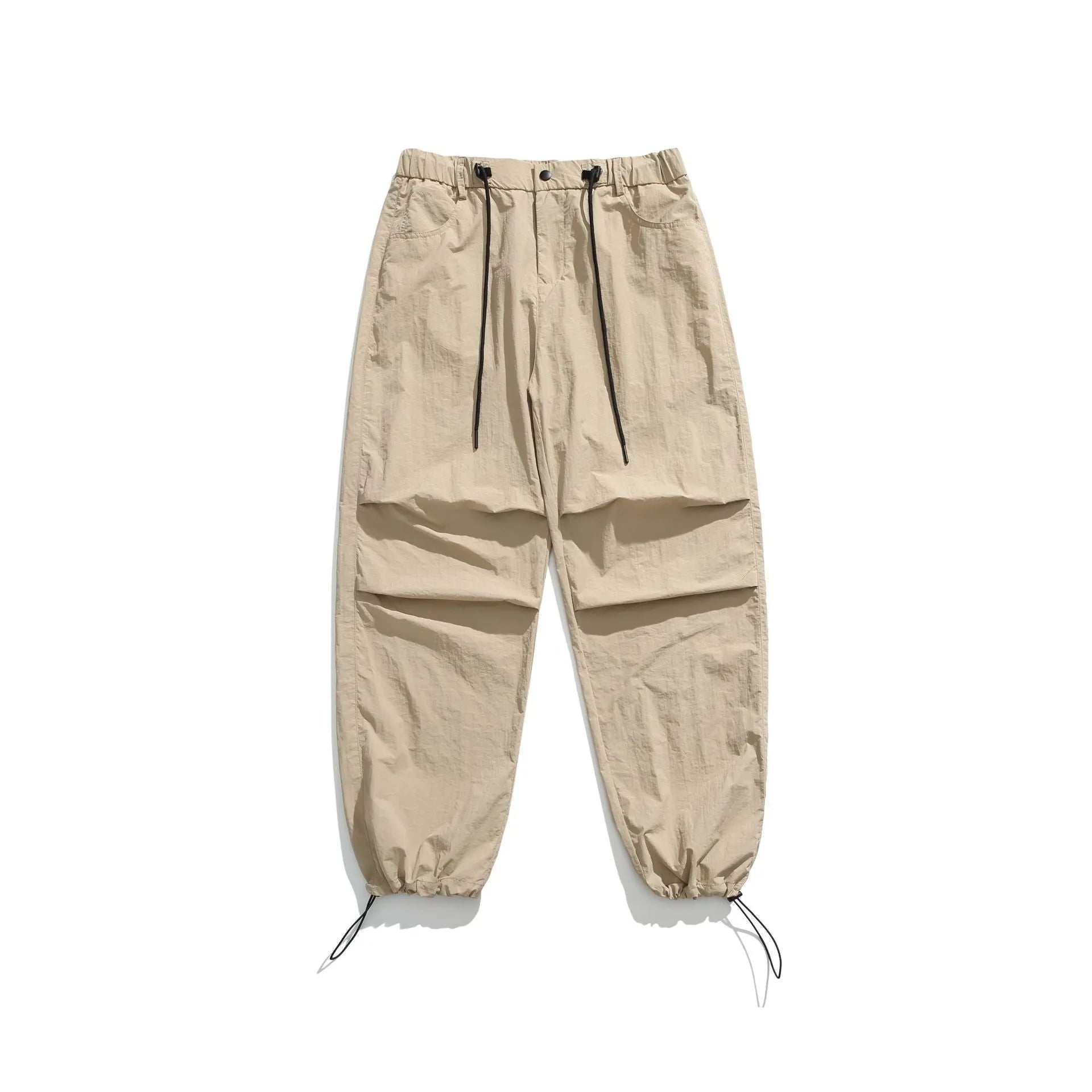 Man wearing loose straight-leg casual trousers in thin ice silk nylon fabric, showing apricot colour option.