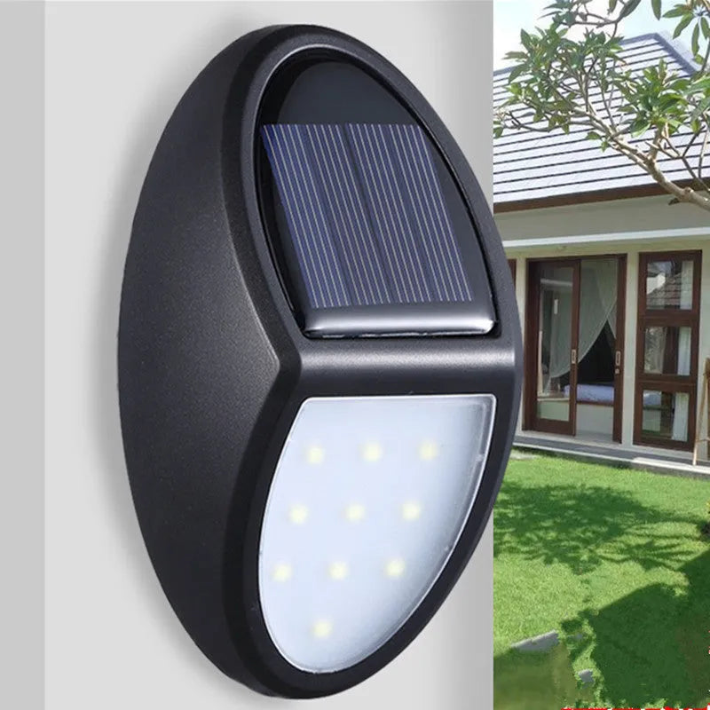 Black LED solar wall light with solar panel and automatic sensor for outdoor use