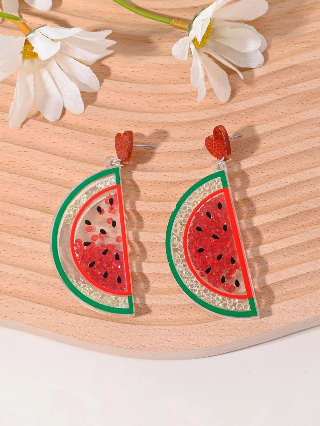 Colourful acrylic fruit and ice cream dangle earrings for women on a white background.