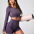 Women's black high waist yoga pants and long sleeve top set made from quick-dry fabric