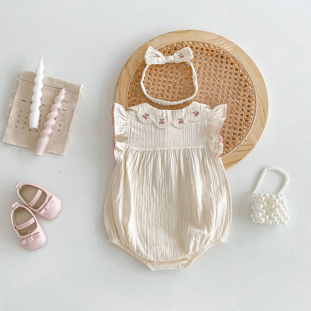 apricot cotton sleeveless double breasted baby jumpsuit with matching hair band