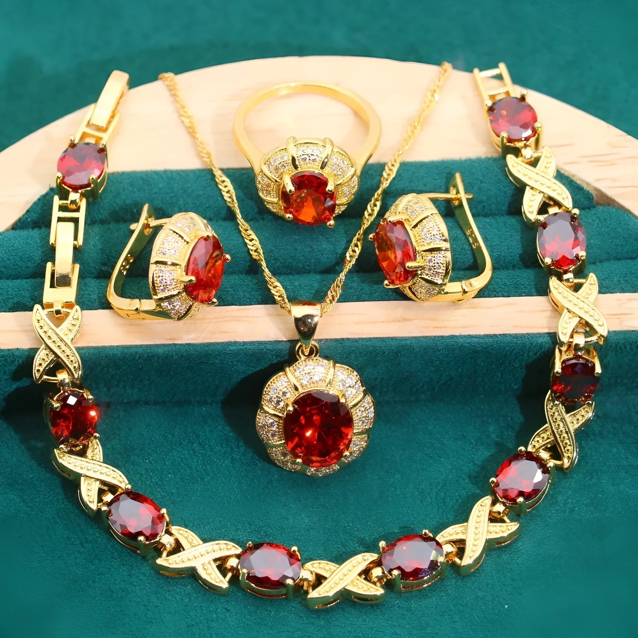 18k gold plated jewellery set showing necklace, earrings, ring and bracelet with coloured cubic zirconia stones.