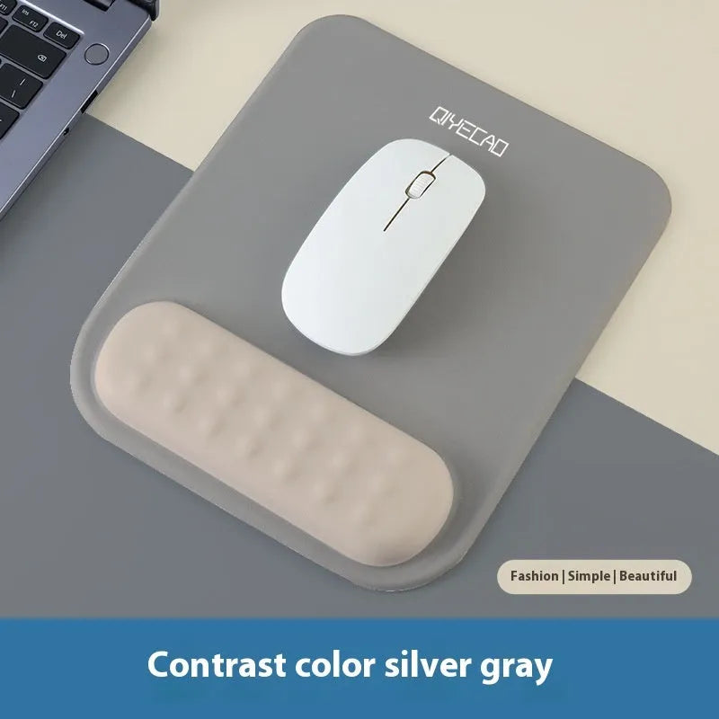 Ergonomic cloth silicone mouse pad with raised wrist support in mint green colour.