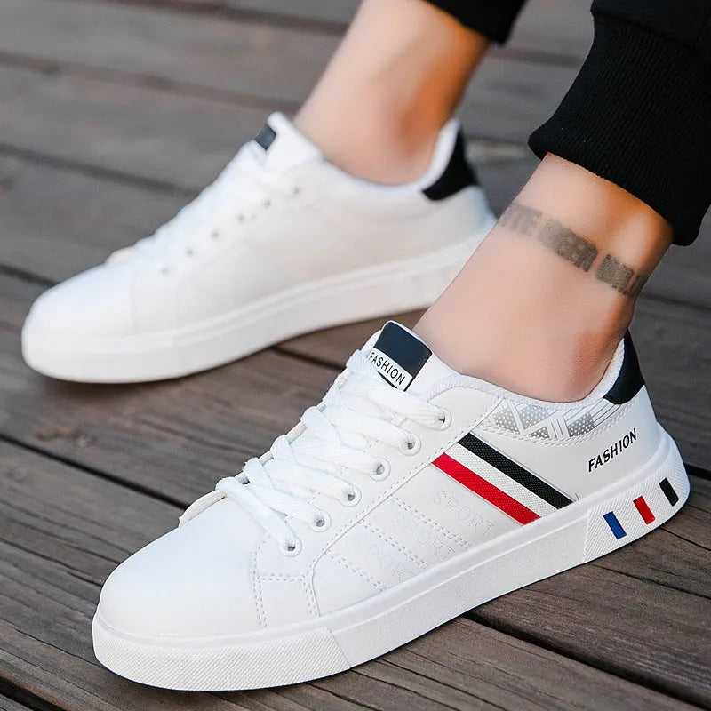 A pair of sports shoes on a white background, shown in black, grey, or white colour options.
