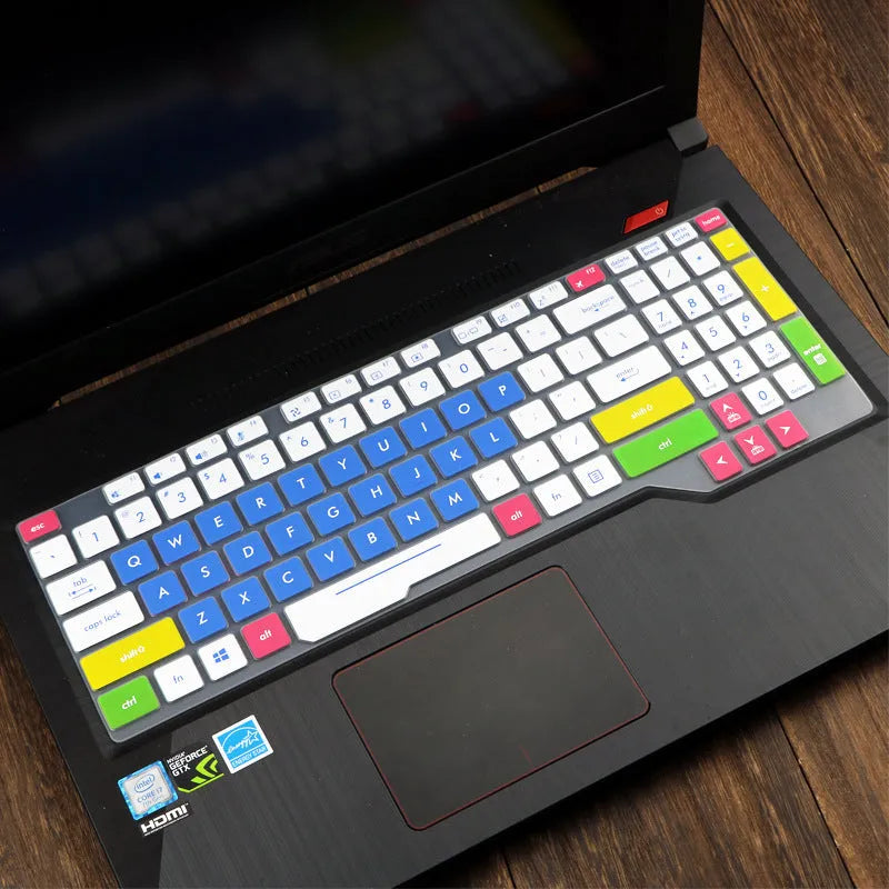 Clear protective keyboard film cover for ASUS Flight 14-inch laptop on a keyboard.