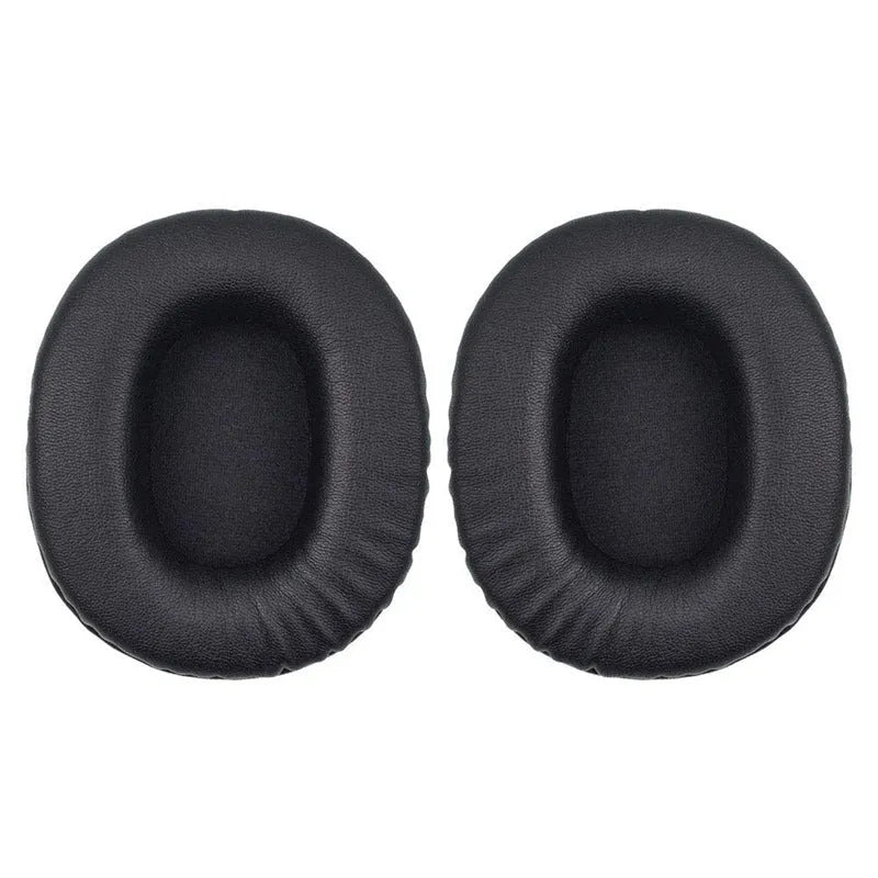 Two black PU leather headphone covers for Sony 1R headphones on a flat surface.