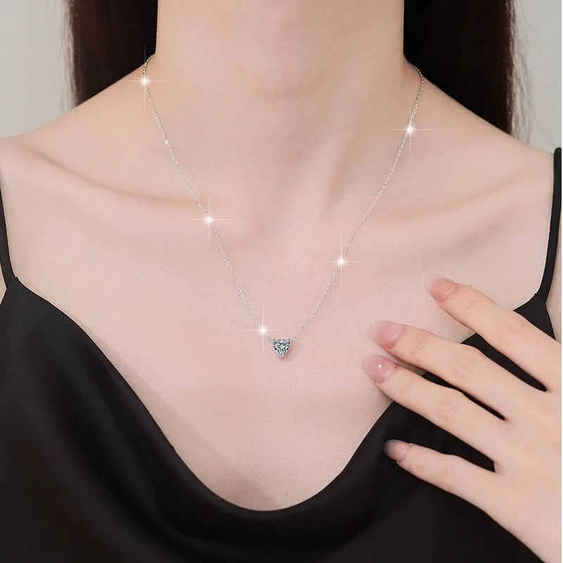 925 silver heart-shaped moissanite pendant necklace with cross chain on display