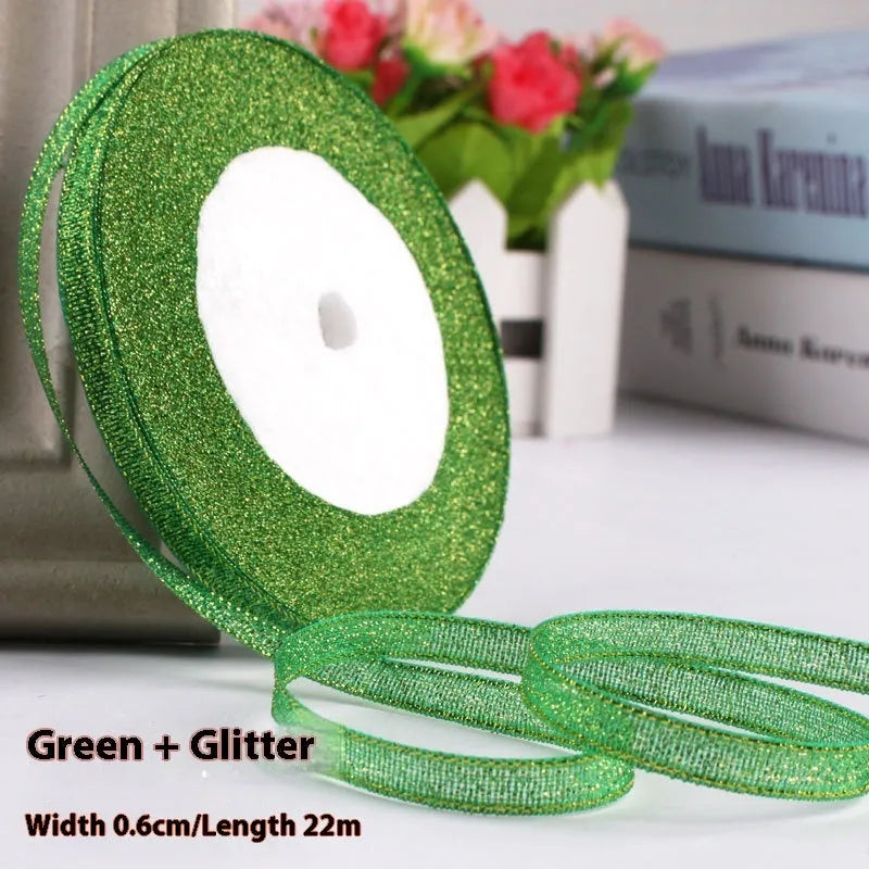 Roll of 0.6cm wide coloured polyester gift ribbon with 22 metre length.