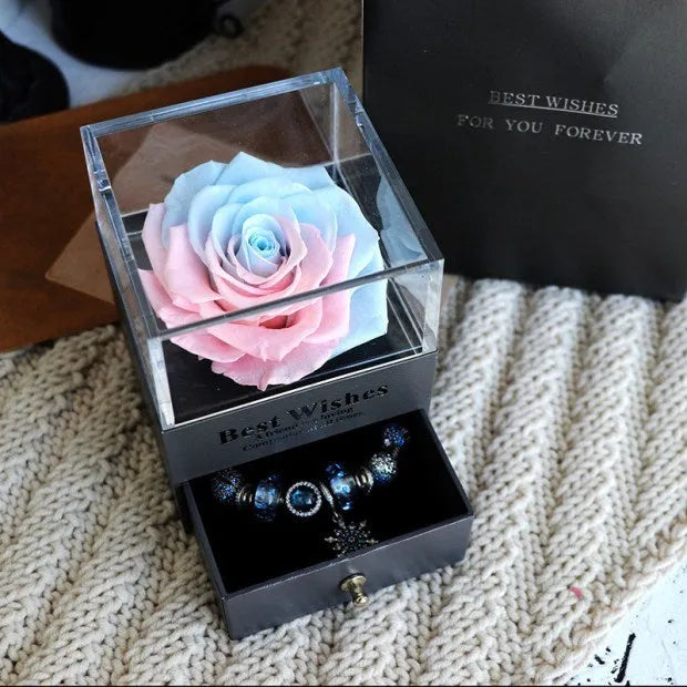 Eternal Flower gift box with preserved roses and carnations inside, measuring 8.5 cm square by 10.5 cm high