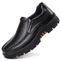 Men's black cowhide leather slip-on business casual shoes with a rubber sole.