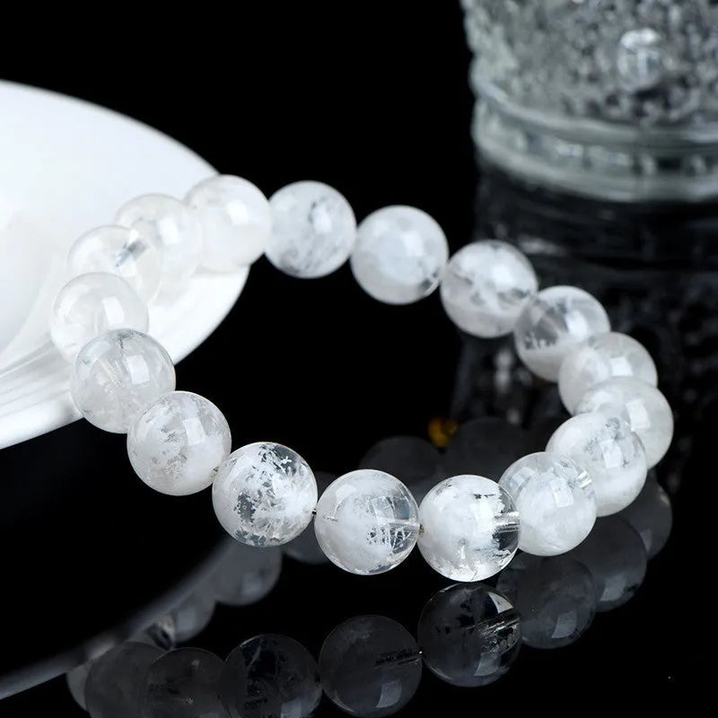 Women's crystal bracelet with round blizzard snowflake beads and geometric Ruyi Xiangyun design.