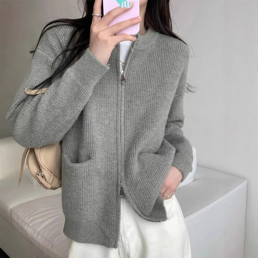 Beige viscose knit long sleeve cardigan sweater coat on a hanger