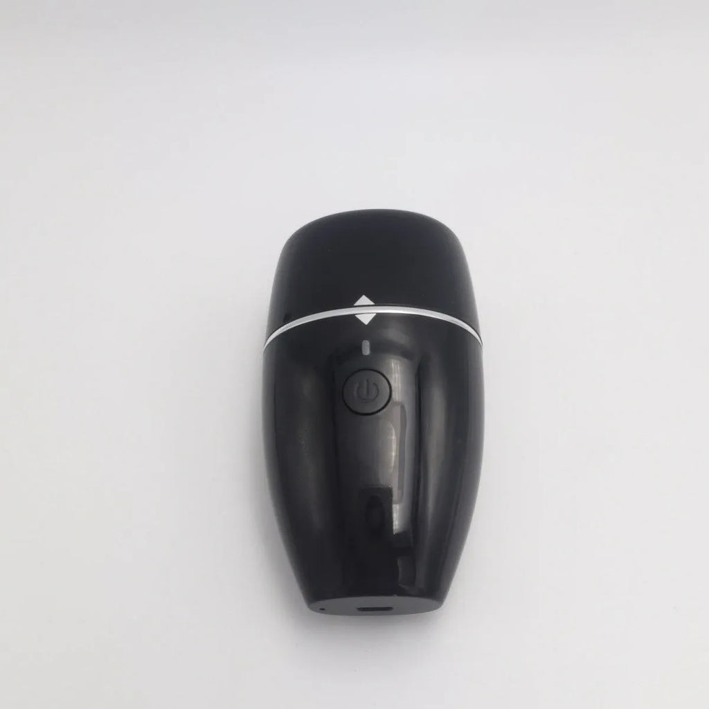 Black and white electric silicone lip plumper device with USB cable.