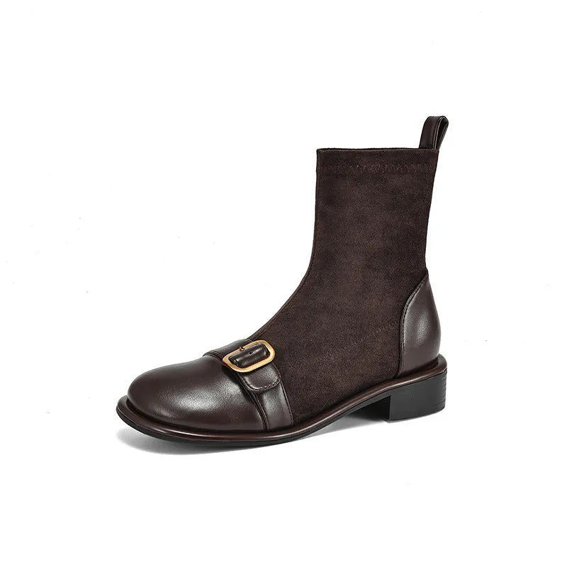 Women's black casual low-heel ankle boots with belt buckle detail and front lace-up closure.