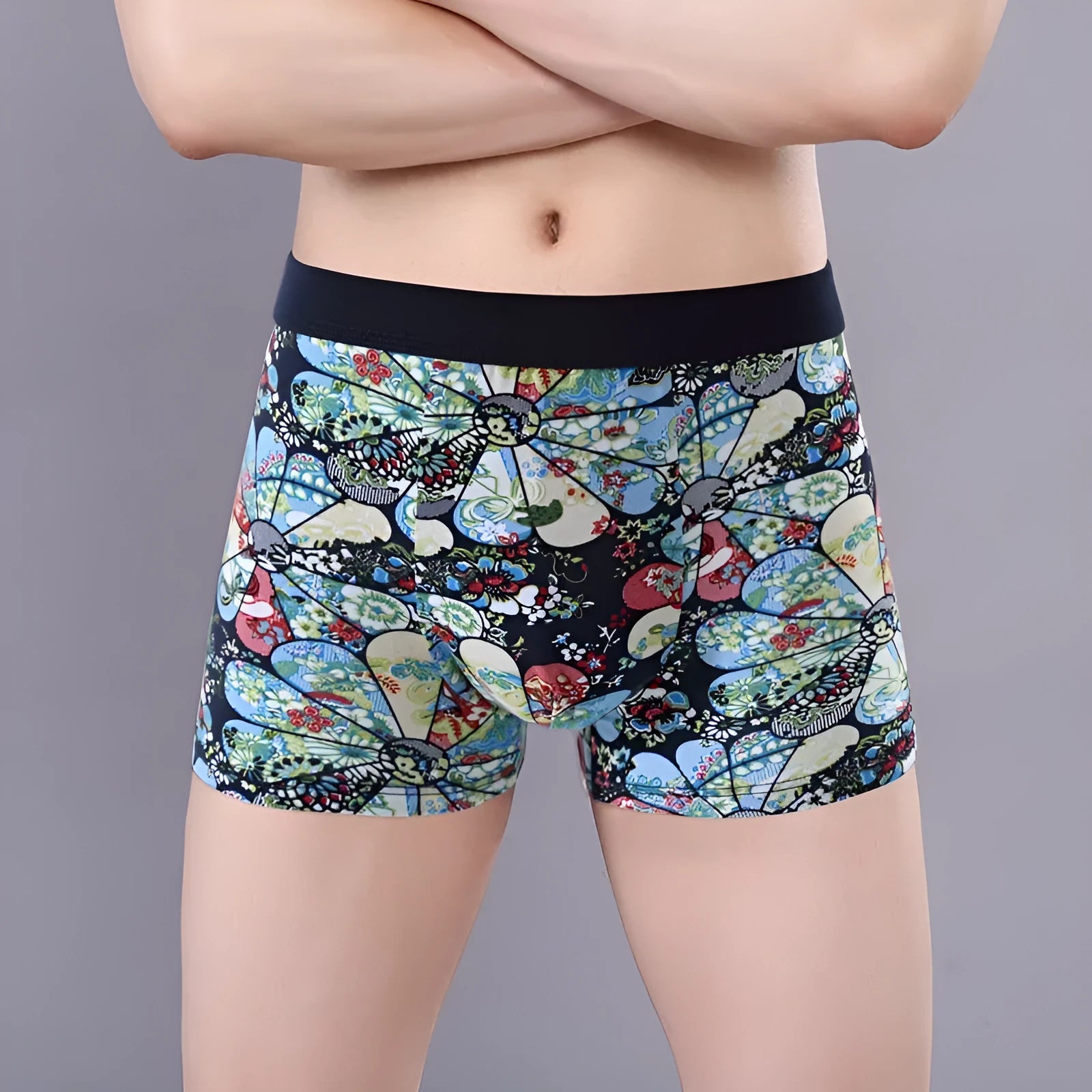 Men's cotton boxer shorts with floral print, showing mid-waist fit and U-shaped convex design.