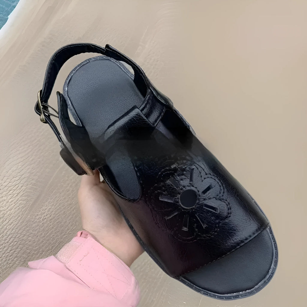 Men's black embroidered floral pattern beach sandals with flat heel on a white background.