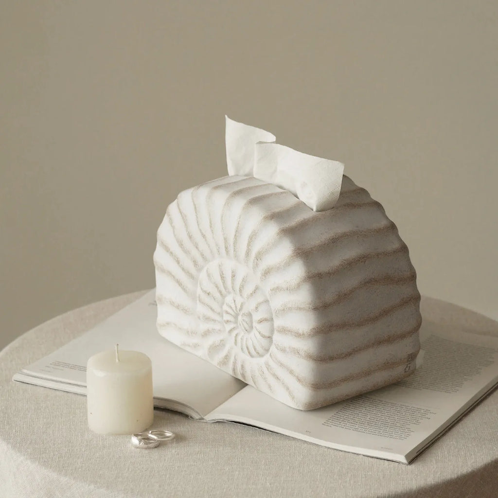 Conch ramble coloured resin decorative tissue box cover with a modern simple design.