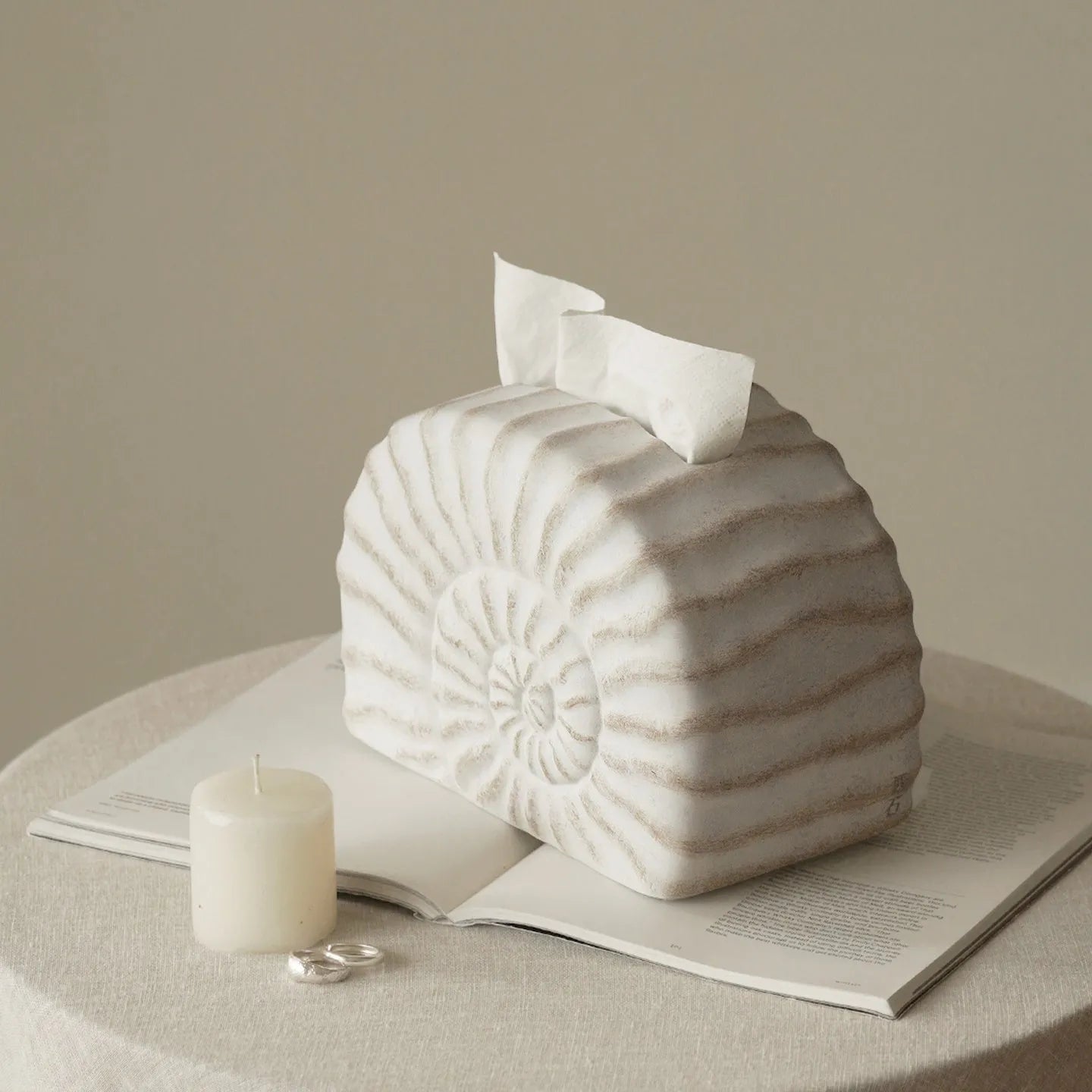 Conch ramble coloured resin decorative tissue box cover with a modern simple design.