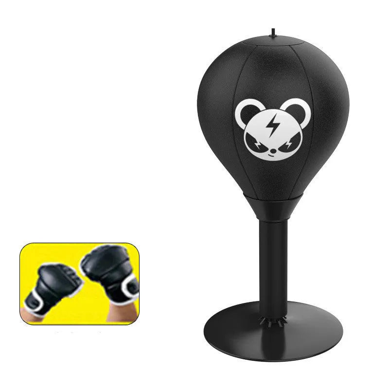 Tabletop boxing speed ball with suction cup base, inflatable PU leather sphere, and pump on a wooden desk.