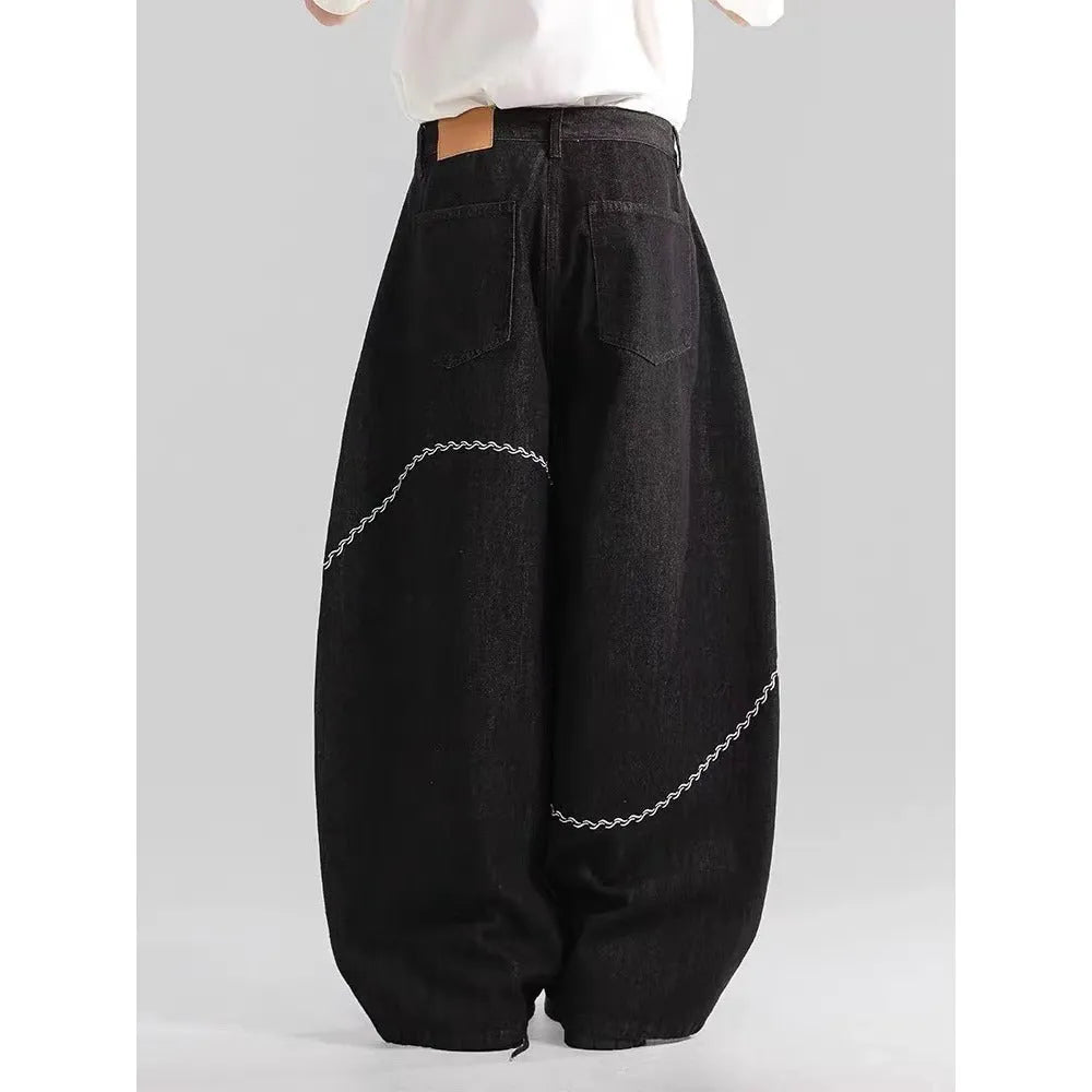 Black straight leg trousers with micro-elastic denim fabric and zip fly opening